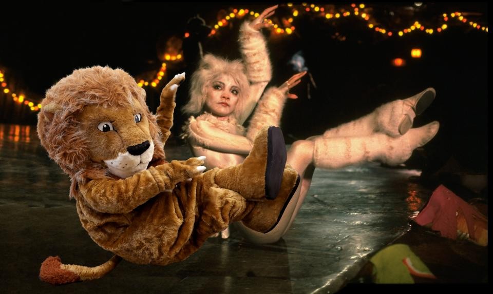 The Library's Lion mascot photoshopped into a photo from the musical ‘Cats’