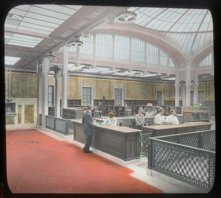 large room with glass ceiling where women are working behind desks