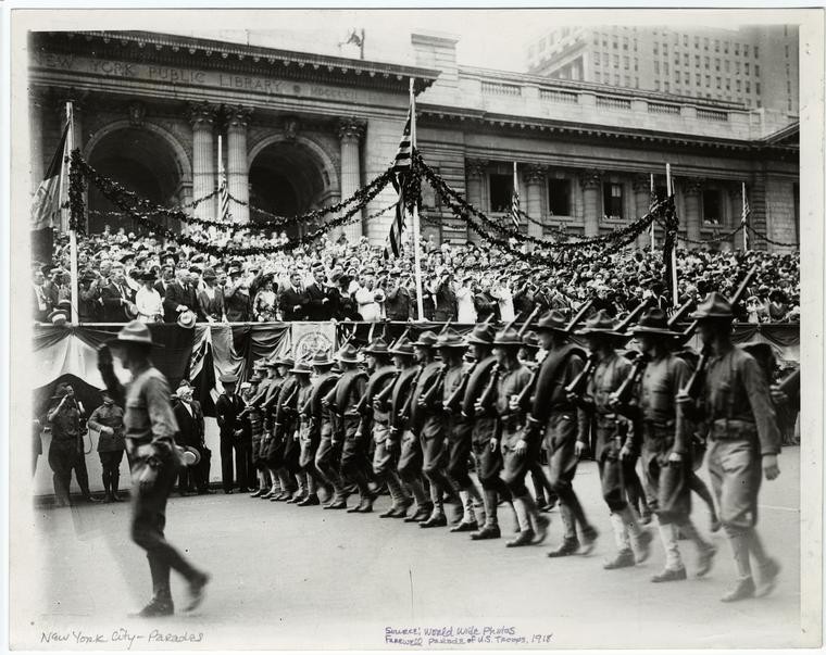 soldiers parade past NYPL Main building