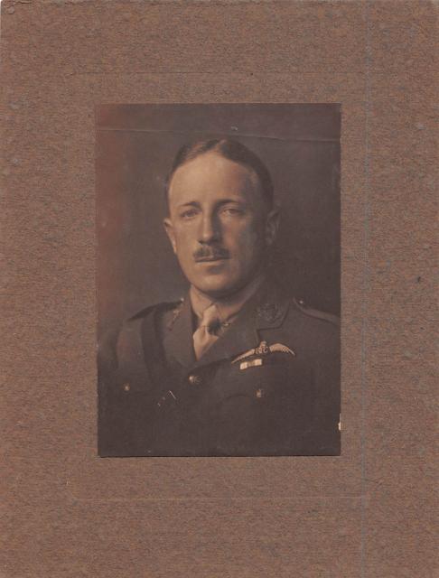 brown tinted photo portrait of man in uniform